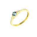 Sortija oro amarillo con piedra azul